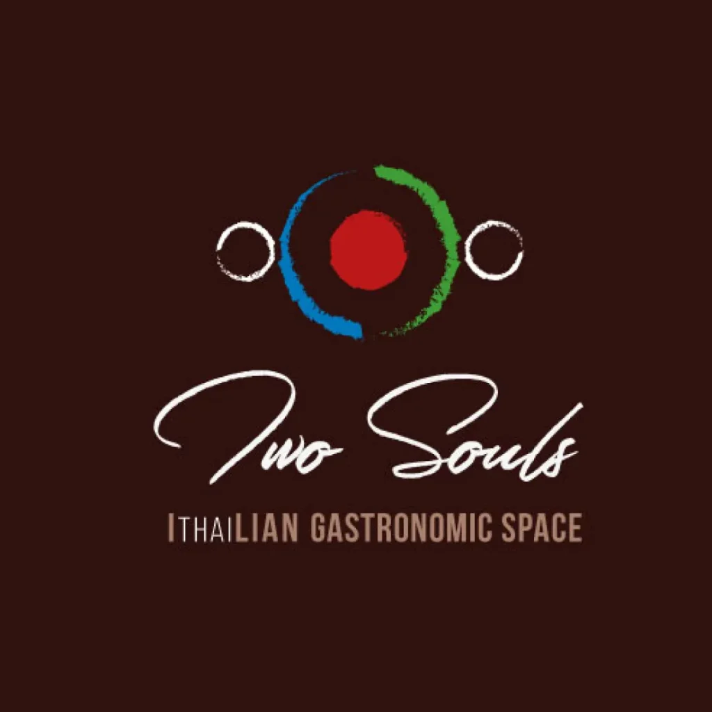 Logo Two Souls - IThaiLian Gastronomic Space, con simbolo circolare rosso, blu e verde su sfondo bordeaux scuro